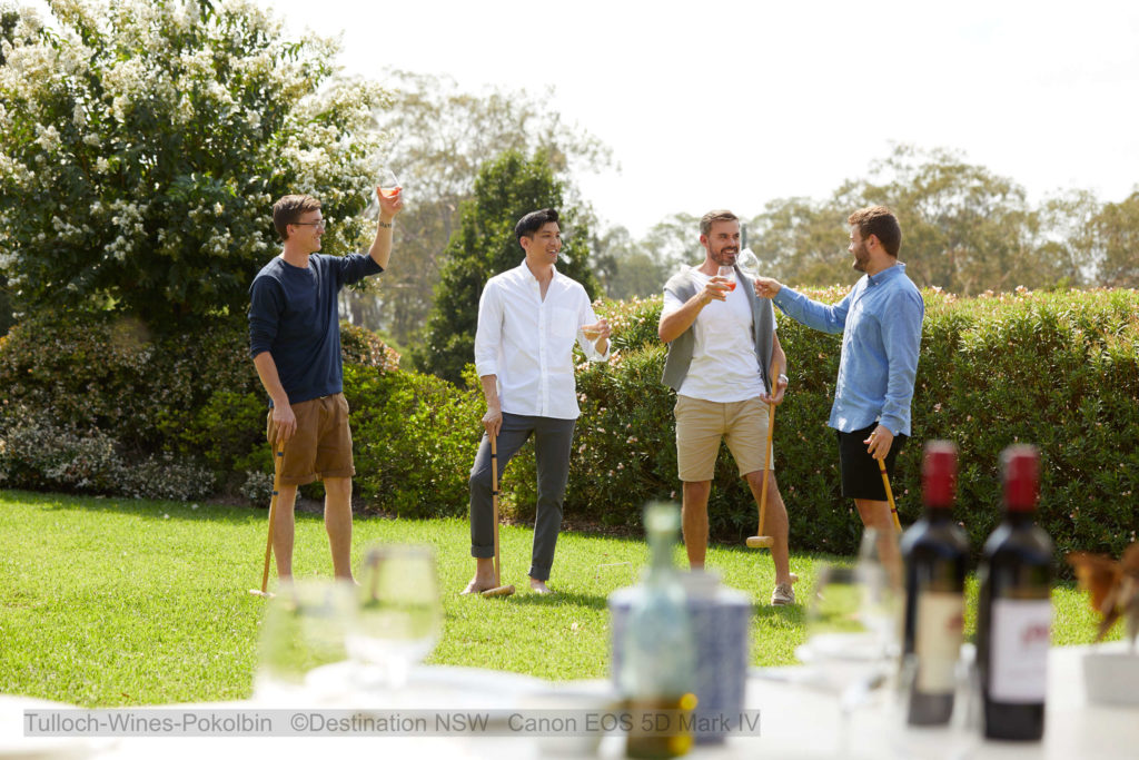 Friends enjoying wine and a game of croquet at Tulloch Wines, Pokolbin.